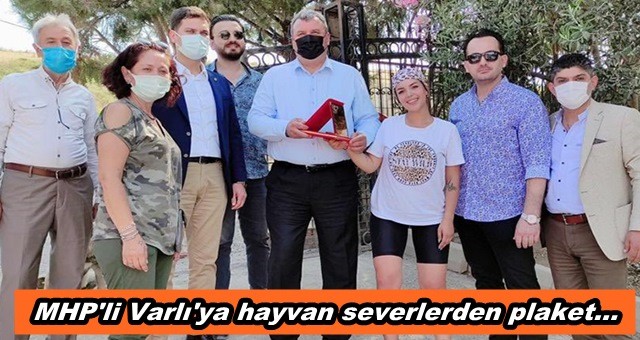 MHP'li Varlı'ya hayvan severlerden plaket...